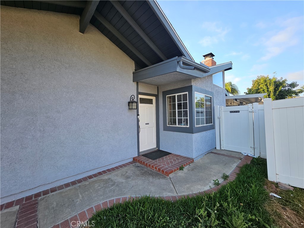 4481 Wyngate Circle Irvine, CA 92604 - Photo 39 of 42 a front view of a house with garden