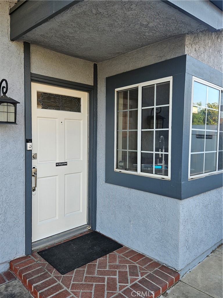 4481 Wyngate Circle Irvine, CA 92604 - Photo 40 of 42 a view of an empty room with wooden floor and a window