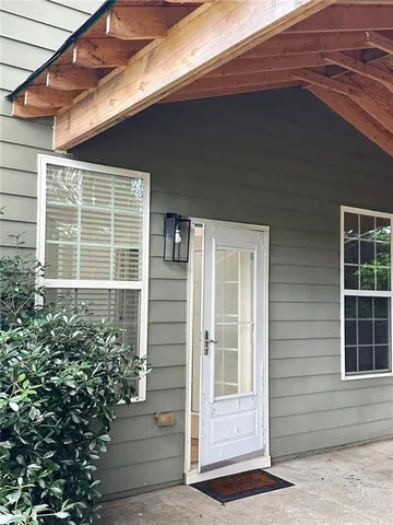 a backyard of a house with seating space