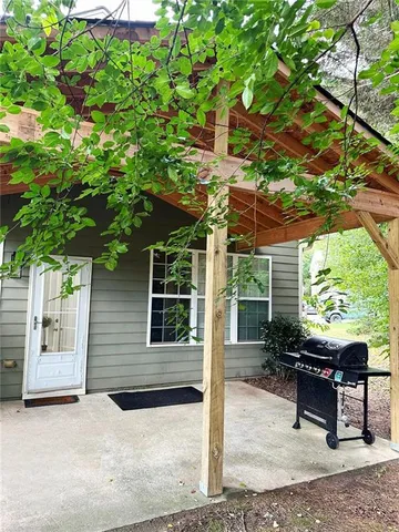a backyard of a house with a garden and plants