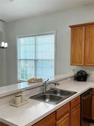 a kitchen with a sink and a window