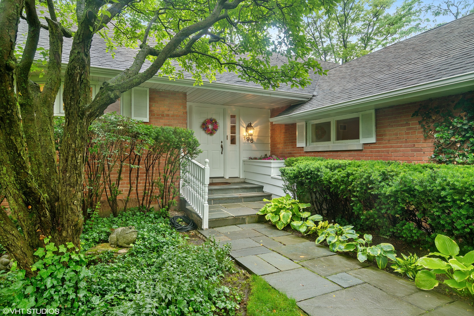 196 Coach Road Northfield, IL 60093 - Photo 2 of 36 a front view of a house with a yard