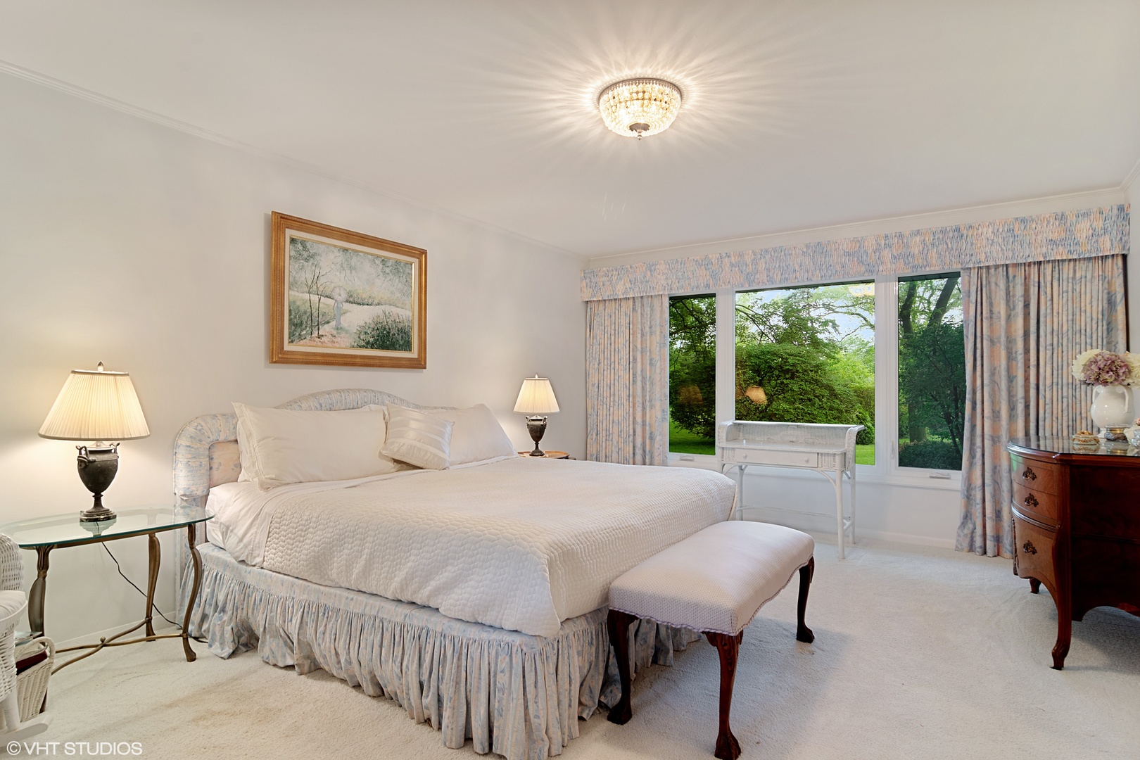 196 Coach Road Northfield, IL 60093 - Photo 16 of 36 a bedroom with a bed painting on wall and a large window