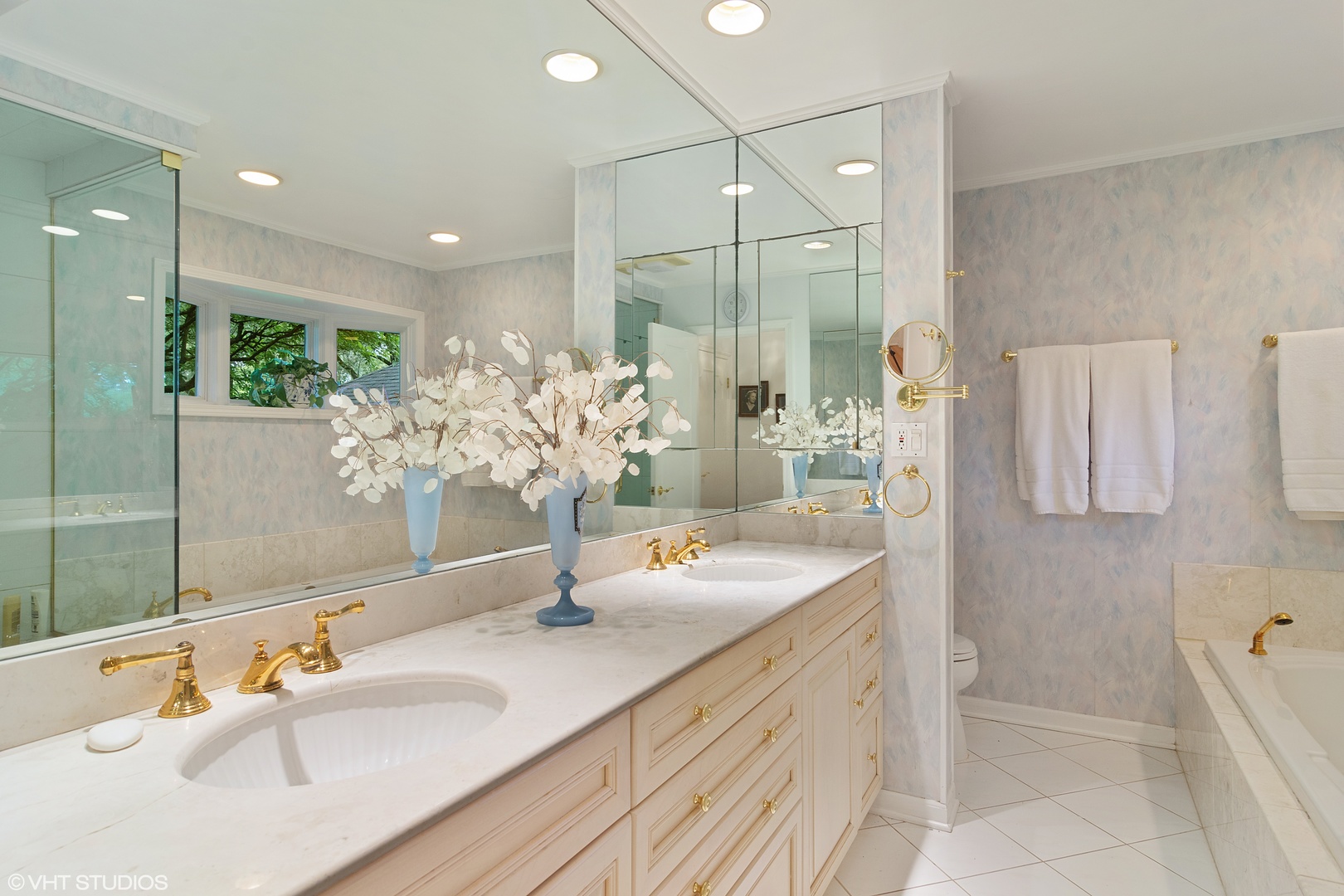 196 Coach Road Northfield, IL 60093 - Photo 17 of 36 a bathroom with a double vanity sink and a mirror