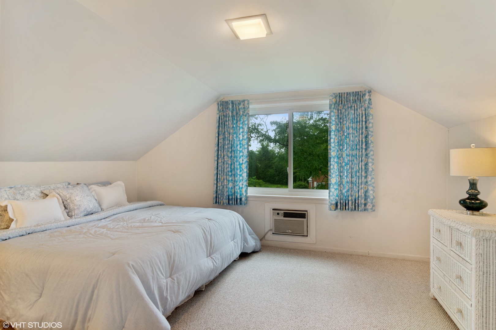 196 Coach Road Northfield, IL 60093 - Photo 19 of 36 a bedroom with a bed and a dresser next to a window