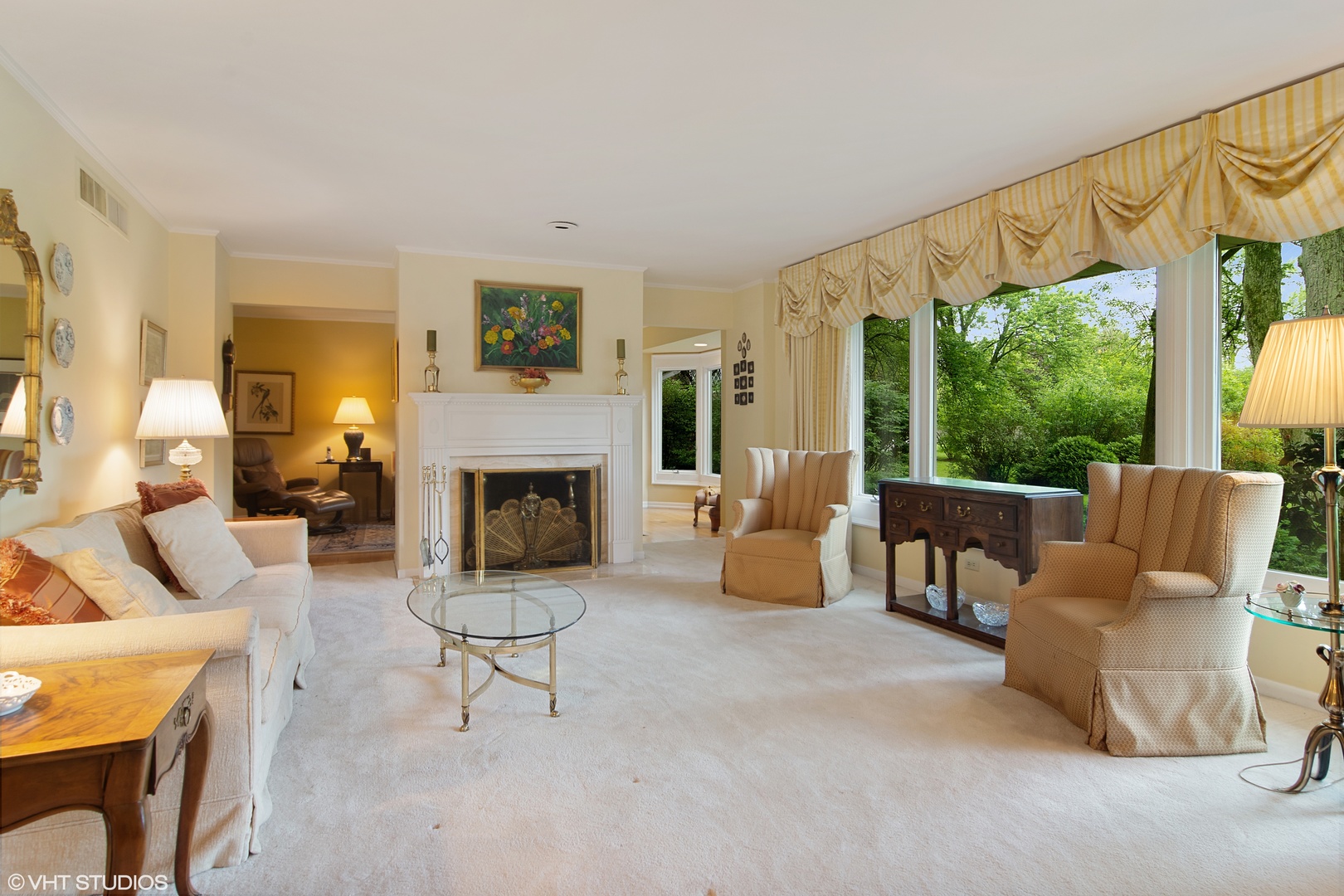 196 Coach Road Northfield, IL 60093 - Photo 6 of 36 a living room with furniture a fireplace and a large window