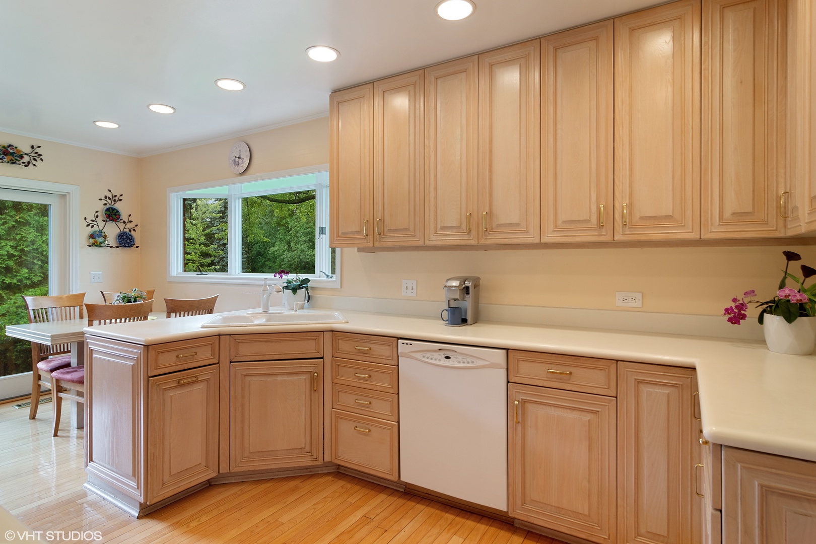 196 Coach Road Northfield, IL 60093 - Photo 7 of 36 a kitchen with a sink cabinets and window