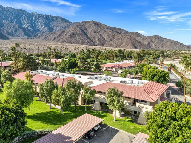 a view of house with outdoor space and mountain view