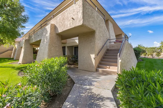 a view of a house with brick walls
