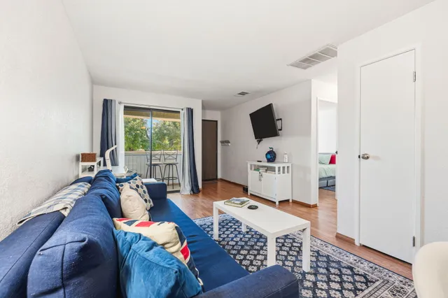 a living room with furniture and a window