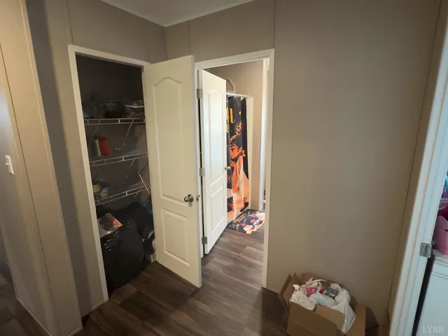 a room with wooden floor and closet