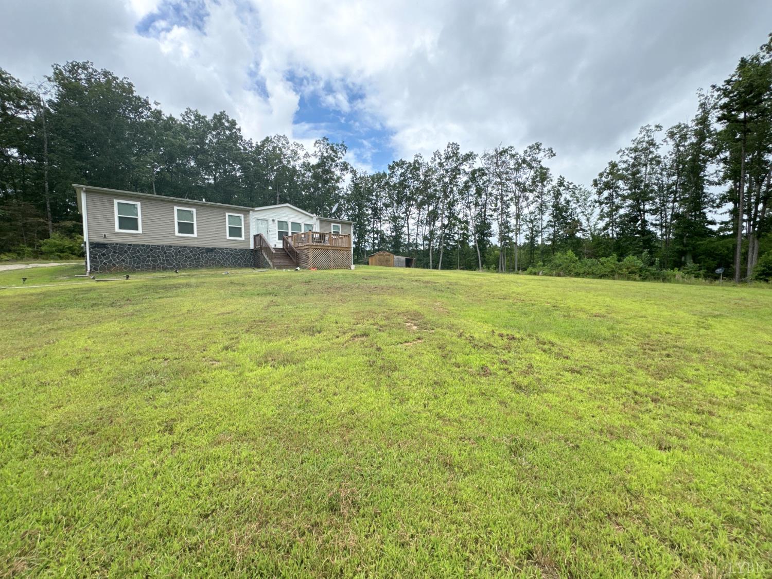 3772 Promise Land Road Appomattox, VA 24522 - Photo 2 of 28 a front view of a house with a garden