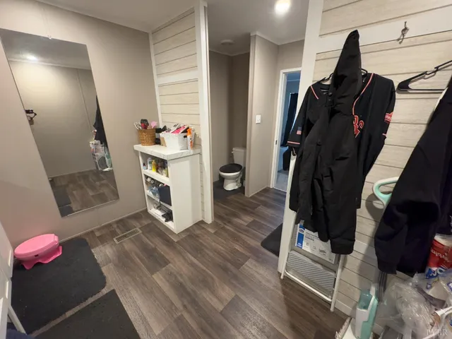 a room with furniture and a wooden floor