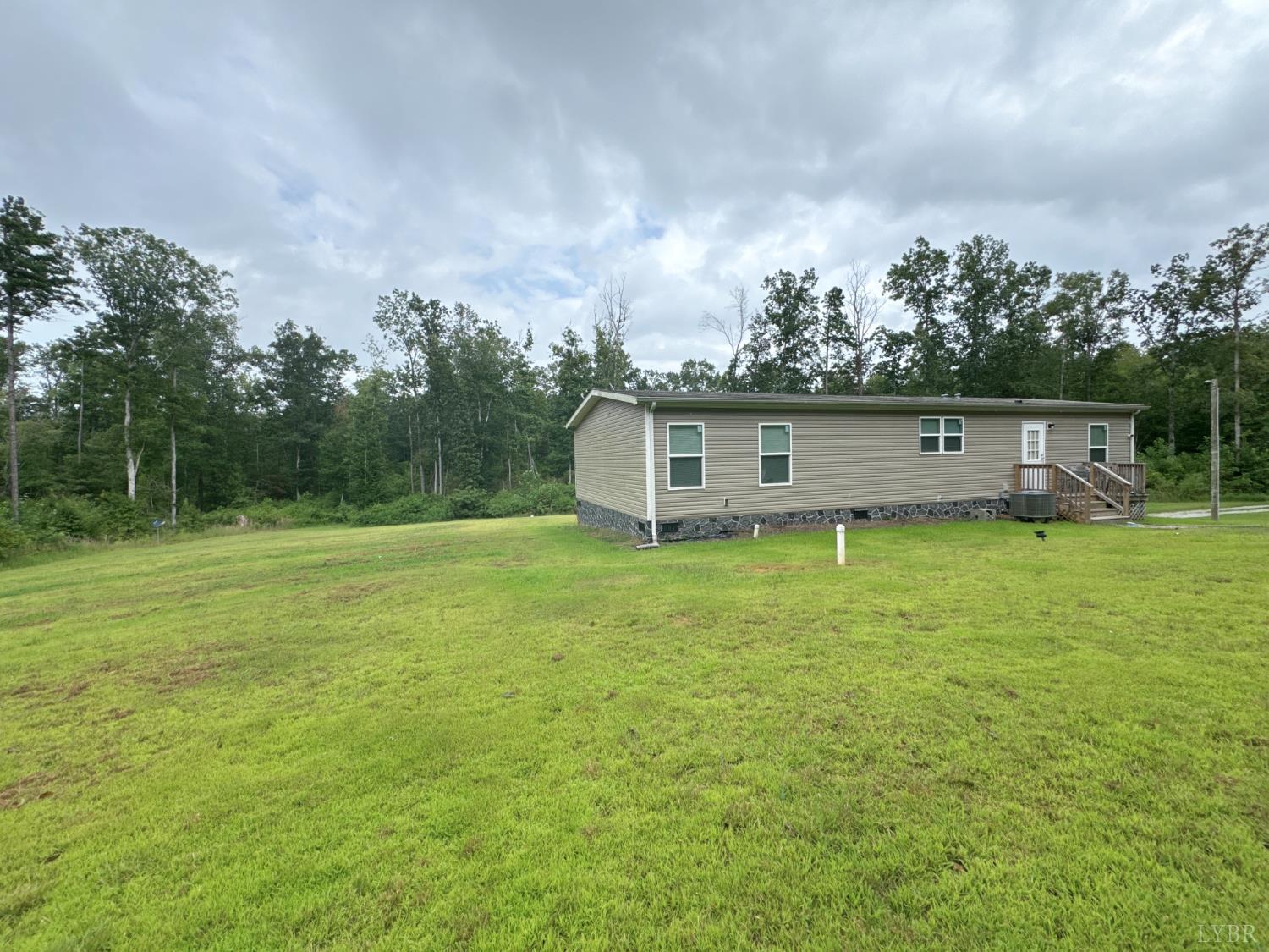 3772 Promise Land Road Appomattox, VA 24522 - Photo 4 of 28 a view of a house with a backyard