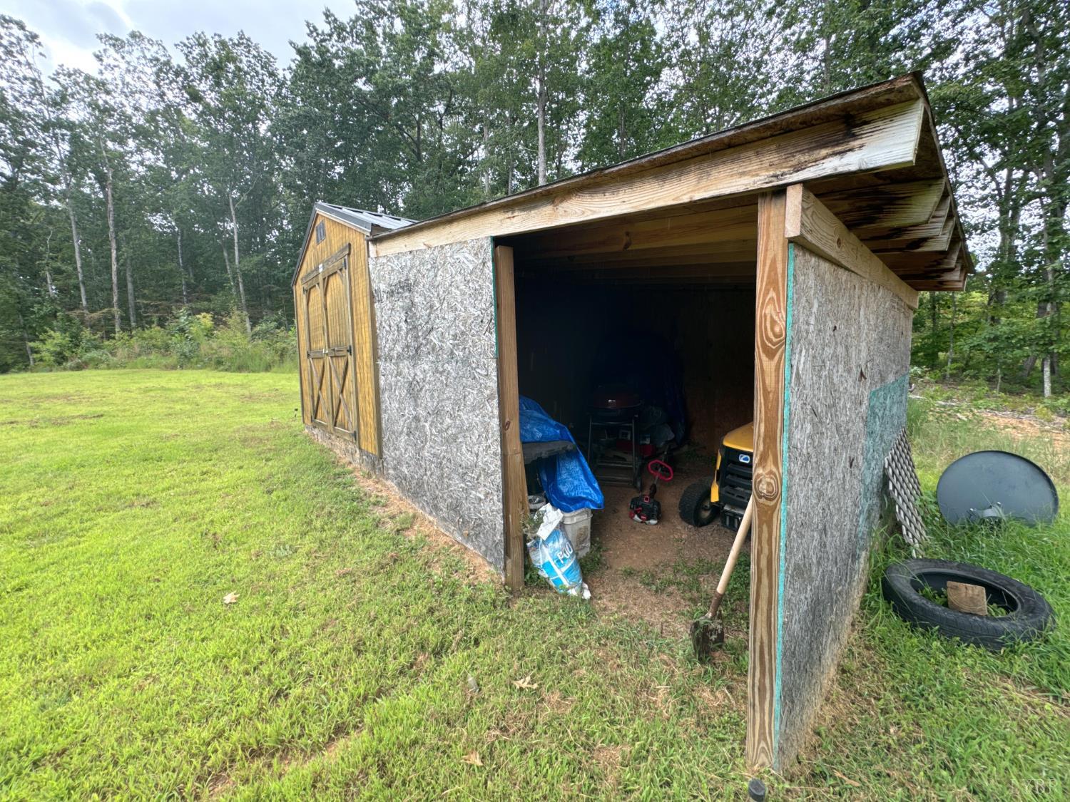 3772 Promise Land Road Appomattox, VA 24522 - Photo 9 of 28 a backyard of a house with seating space