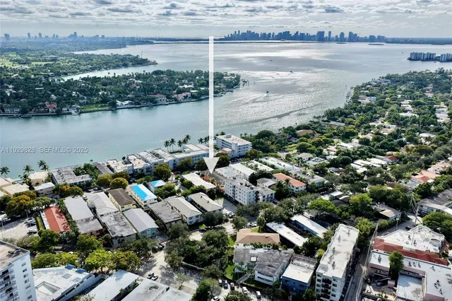 an aerial view of a city with lake view