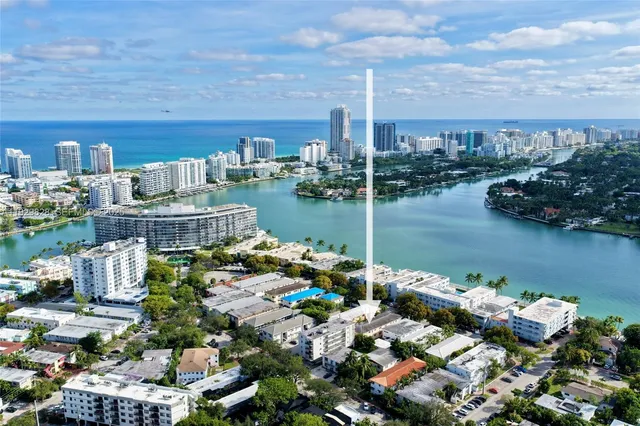 a kitchen with white cabinets and sink