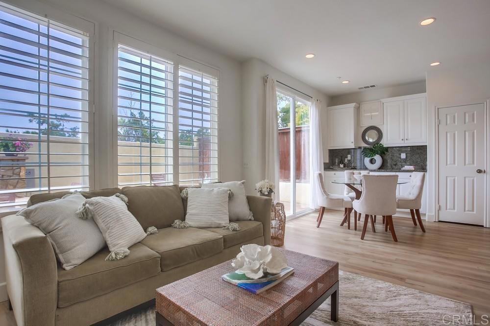 518 Beach Street Encinitas, CA 92024 - Photo 14 of 43 a living room with furniture wooden floor and a floor to ceiling window