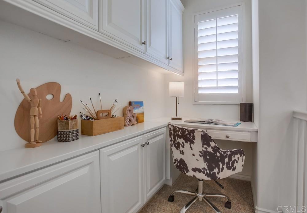 518 Beach Street Encinitas, CA 92024 - Photo 26 of 43 a kitchen with a cabinets a sink and white appliances