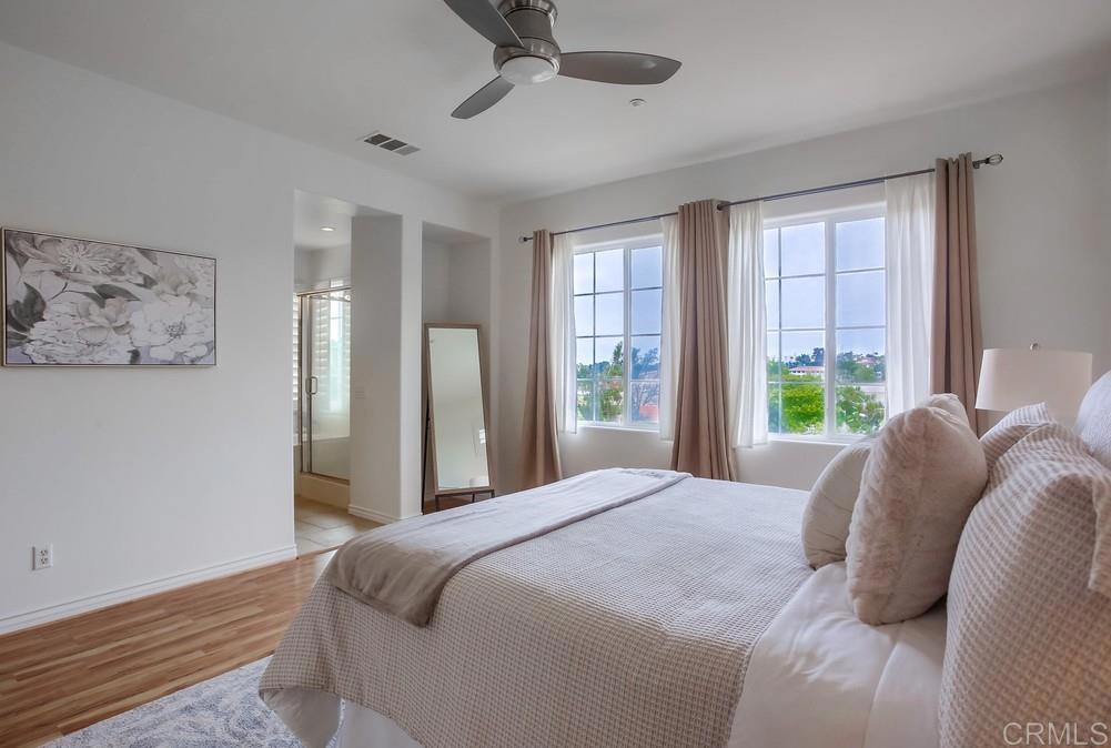 518 Beach Street Encinitas, CA 92024 - Photo 31 of 43 a bedroom with a large bed and a window