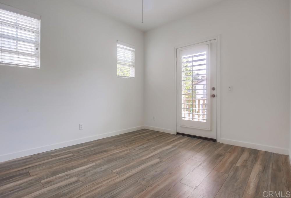518 Beach Street Encinitas, CA 92024 - Photo 36 of 43 an empty room with wooden floor and windows