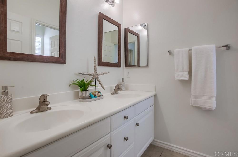 518 Beach Street Encinitas, CA 92024 - Photo 41 of 43 a bathroom with a sink and a mirror