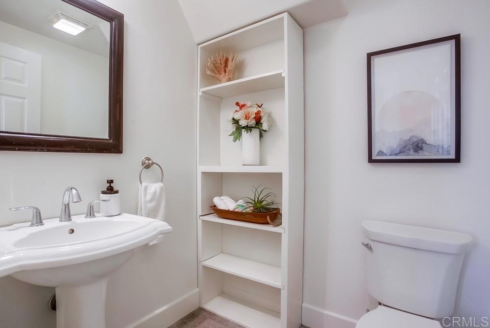 518 Beach Street Encinitas, CA 92024 - Photo 42 of 43 a bathroom with a sink and a mirror