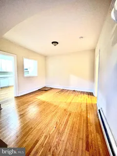 a view of a kitchen with stainless steel appliances granite countertop a stove and a microwave