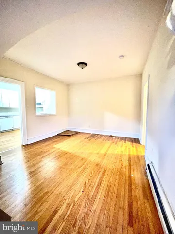 a view of a kitchen with stainless steel appliances granite countertop a stove and a microwave