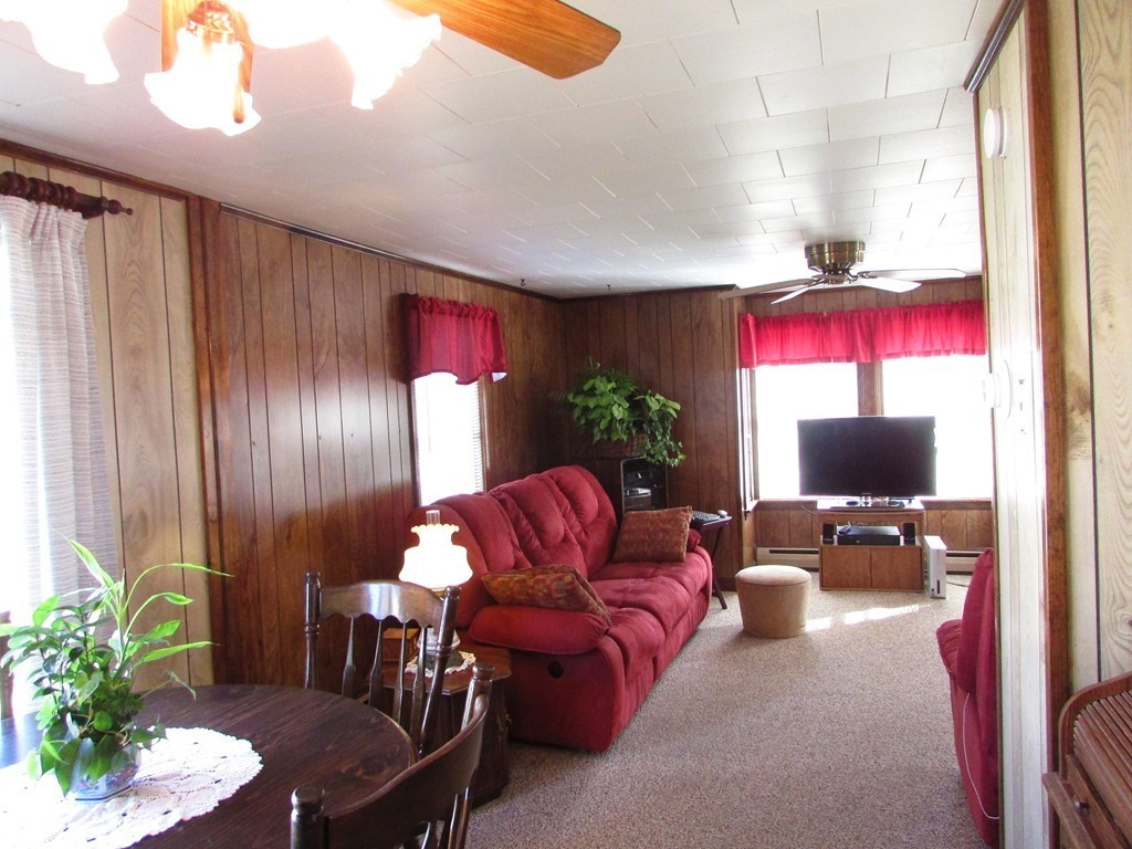 377 County Road Rochester, MA 02576 - Photo 14 of 28 a living room with furniture and a potted plant