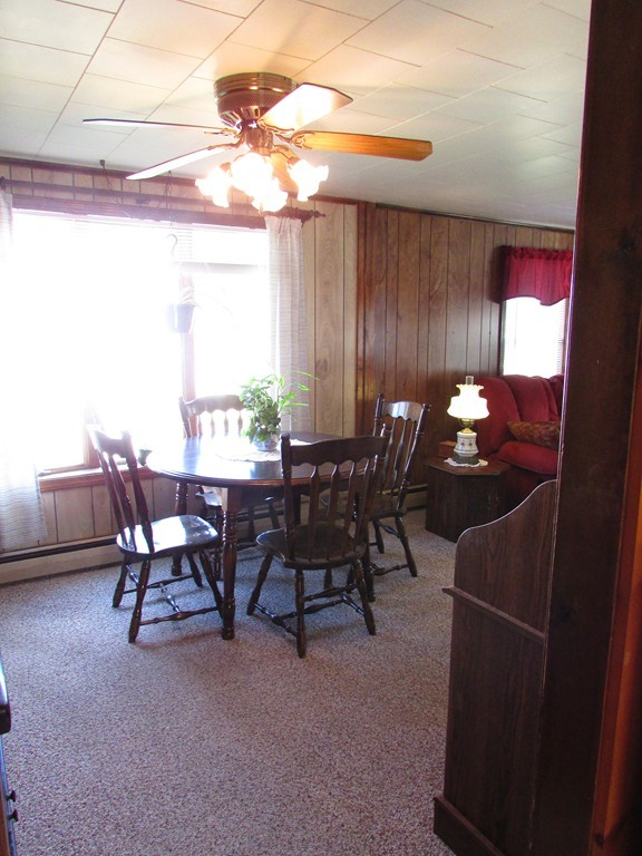 377 County Road Rochester, MA 02576 - Photo 16 of 28 a view of a dining room with furniture and chandelier