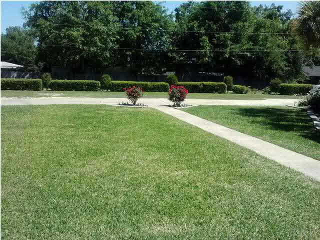 1494 Chemstrand Road Cantonment, FL 32533 - Photo 22 of 25 SIDE VIEW OF FRONT YARD TOWARD DRIVEWAY