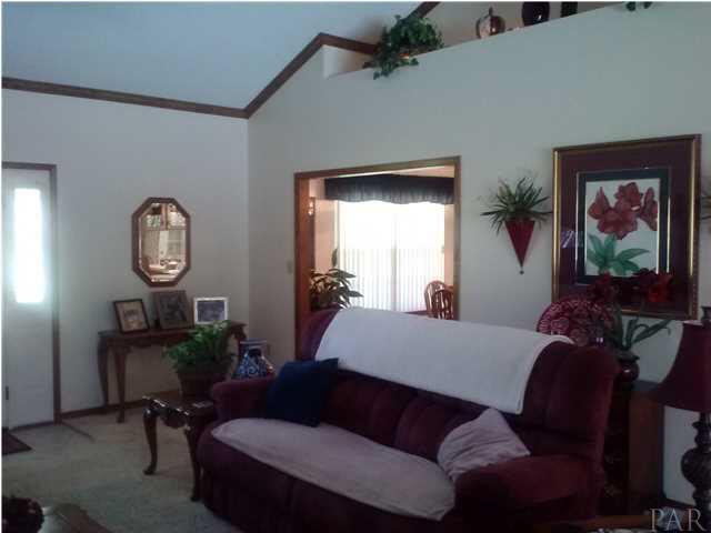 1494 Chemstrand Road Cantonment, FL 32533 - Photo 5 of 25 ANOTHER VIEW OF FAMILY ROOM WITH DINING ROOM TO THE BACK