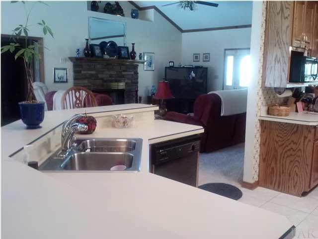 1494 Chemstrand Road Cantonment, FL 32533 - Photo 8 of 25 RAISED BAR AREA OF KITCHEN WITH VIEW TOWARD FAMILY ROOM