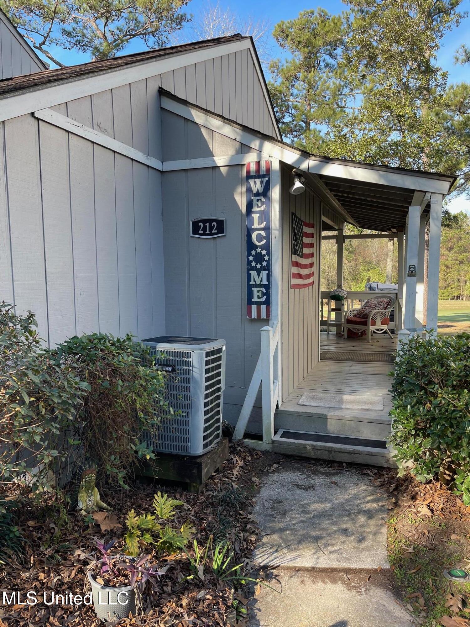 212 Highpoint Drive Diamondhead, MS 39525 - Photo 2 of 31 FRONT ENTRANCE