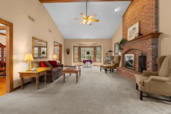 a living room with furniture and a fireplace