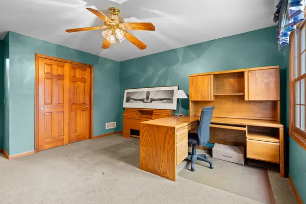 a view of workspace with furniture and windows