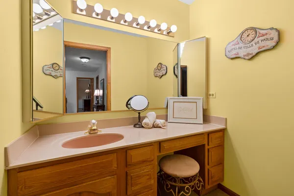 a bathroom with a sink and a mirror