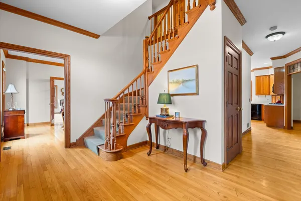 a view of a livingroom with furniture and stairs