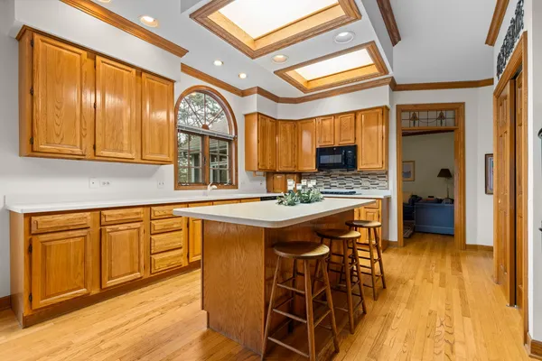 a kitchen with stainless steel appliances granite countertop a stove and a refrigerator