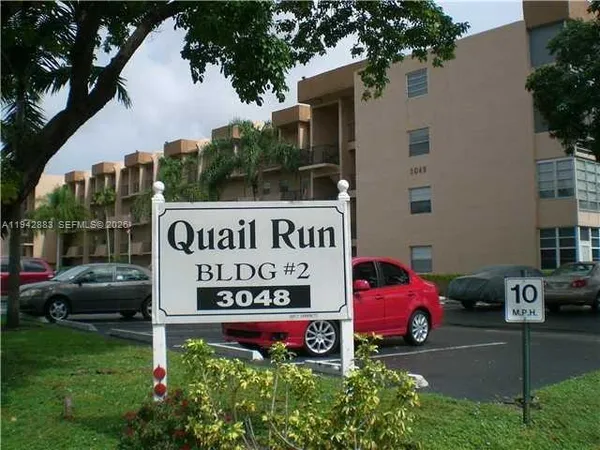 a view of street with parked cars