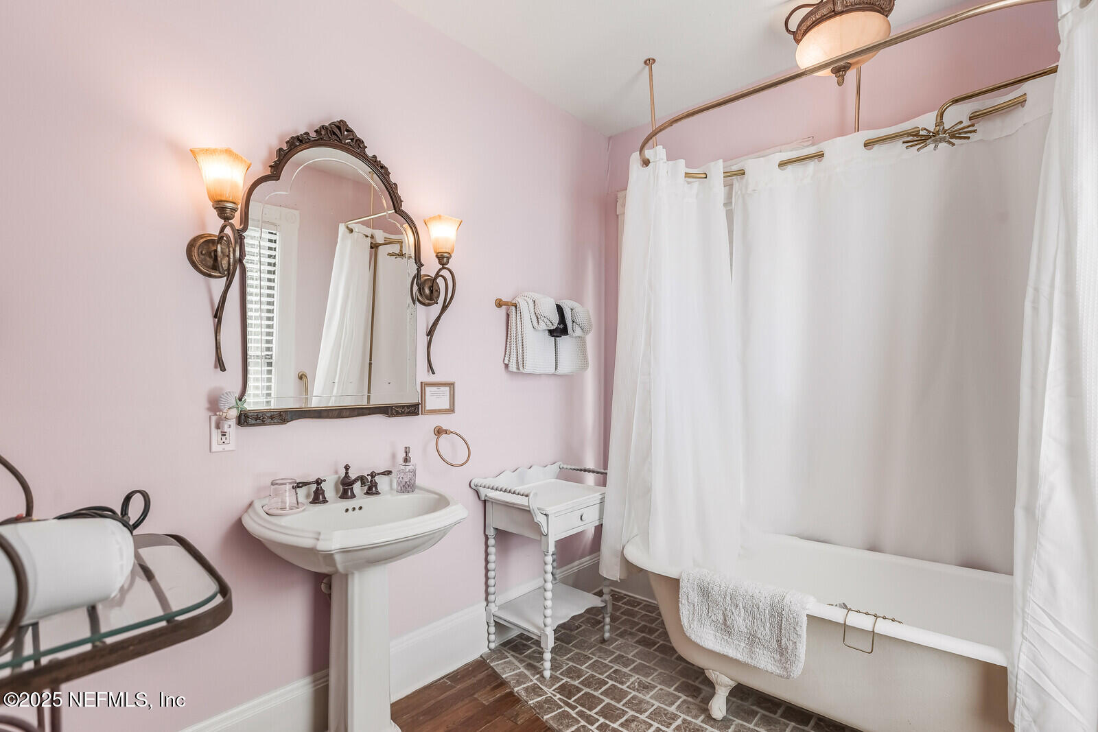 102 South 7th Street Fernandina Beach, FL 32034 - Photo 39 of 65 a bathroom with a sink and a mirror