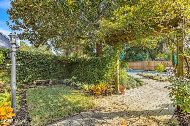 a white toilet sitting next to a bathroom sink and a tub