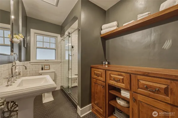 a bathroom with a sink and a mirror