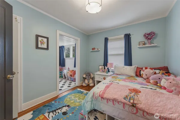 a bed room with furniture and a window