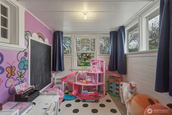 a bed room with a bed and a chair