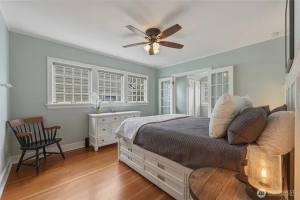a bed room with a bed and a chandelier