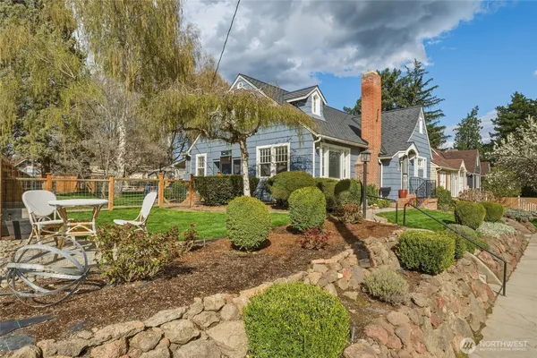 a front view of a house with garden