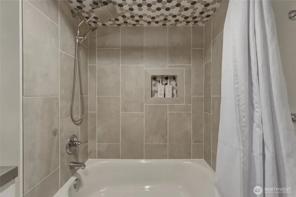 a view of a livingroom with furniture and staircase