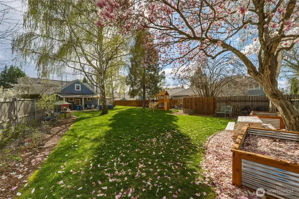 a dining room with furniture and a potted plant